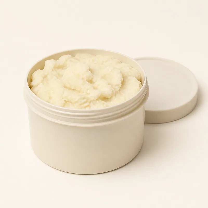 Open tub of unrefined raw shea butter